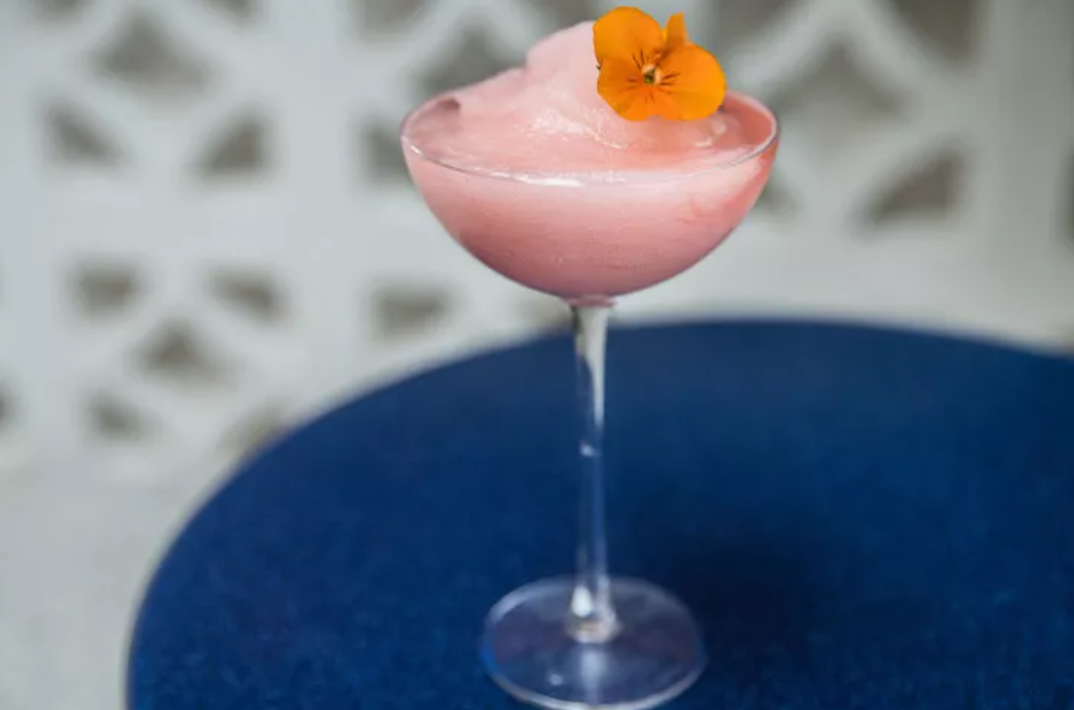 Super Lyan's eye-catching bar with neon pink lighting and contemporary design elements creating a trendy atmosphere.