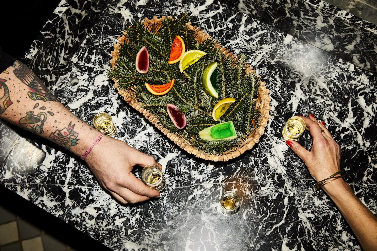 Creative fruit presentation at Silver Lyan featuring colourful jello slices arranged on a bed of pine branches