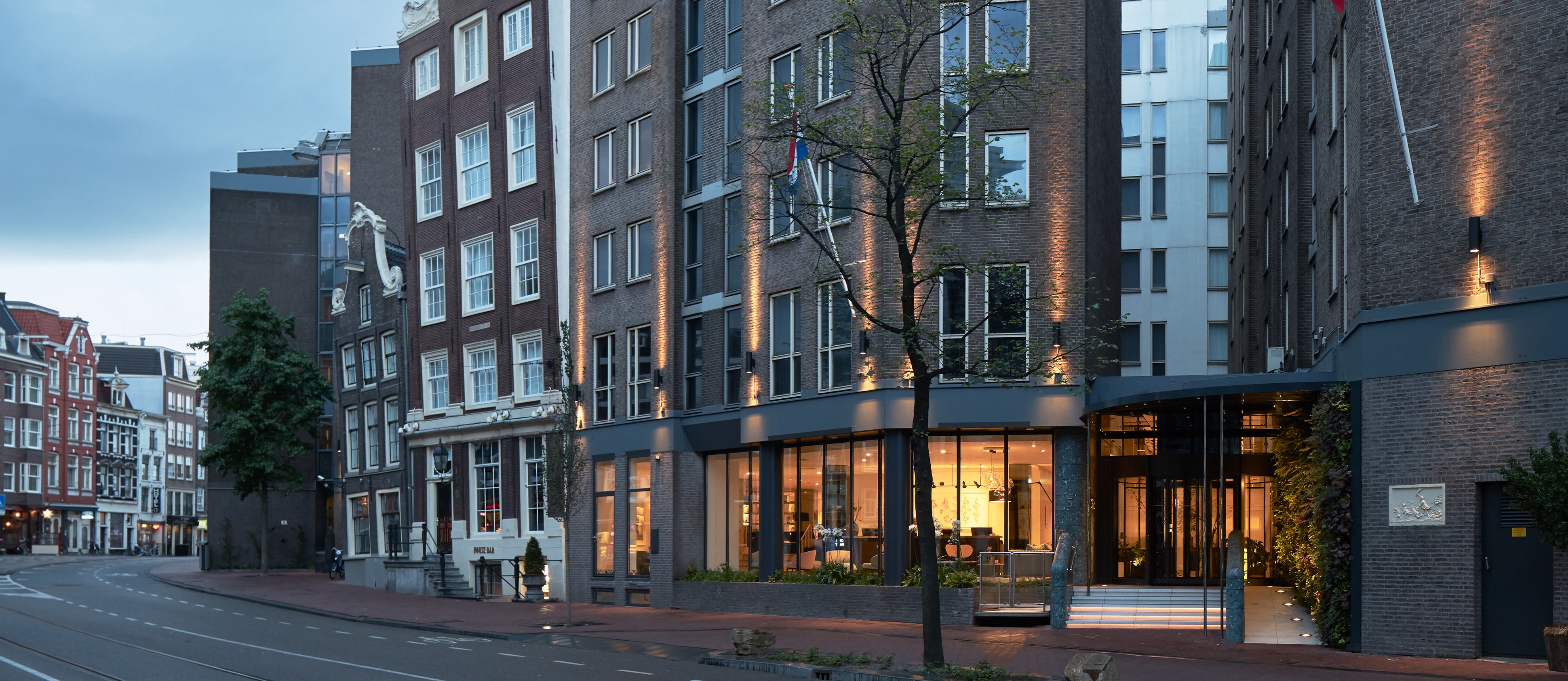 Stylish exterior of the modern Kimpton de Witt hotel in Amsterdam.