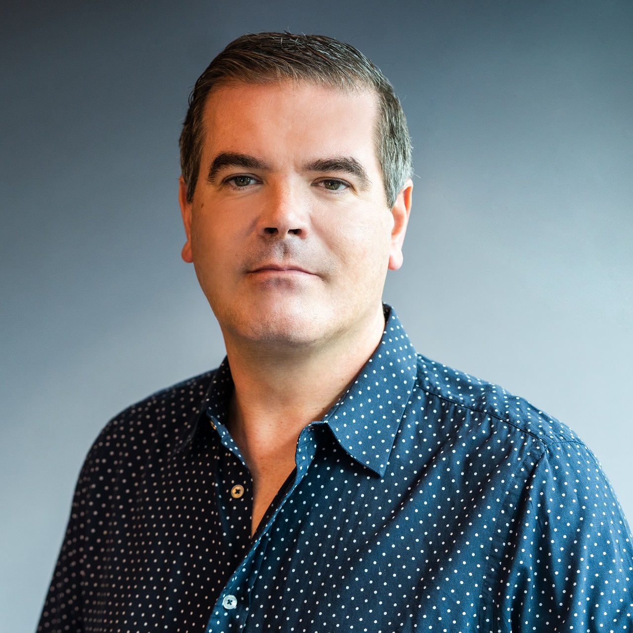 Professional headshot of David Taylor, the CEO of Lore Group, the luxury hotel and restaurant group in Europe and the USA.