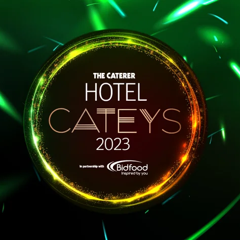 Lore Group's award for Hotel Cateys 2023 displayed with pride with a neon green ring in the background.