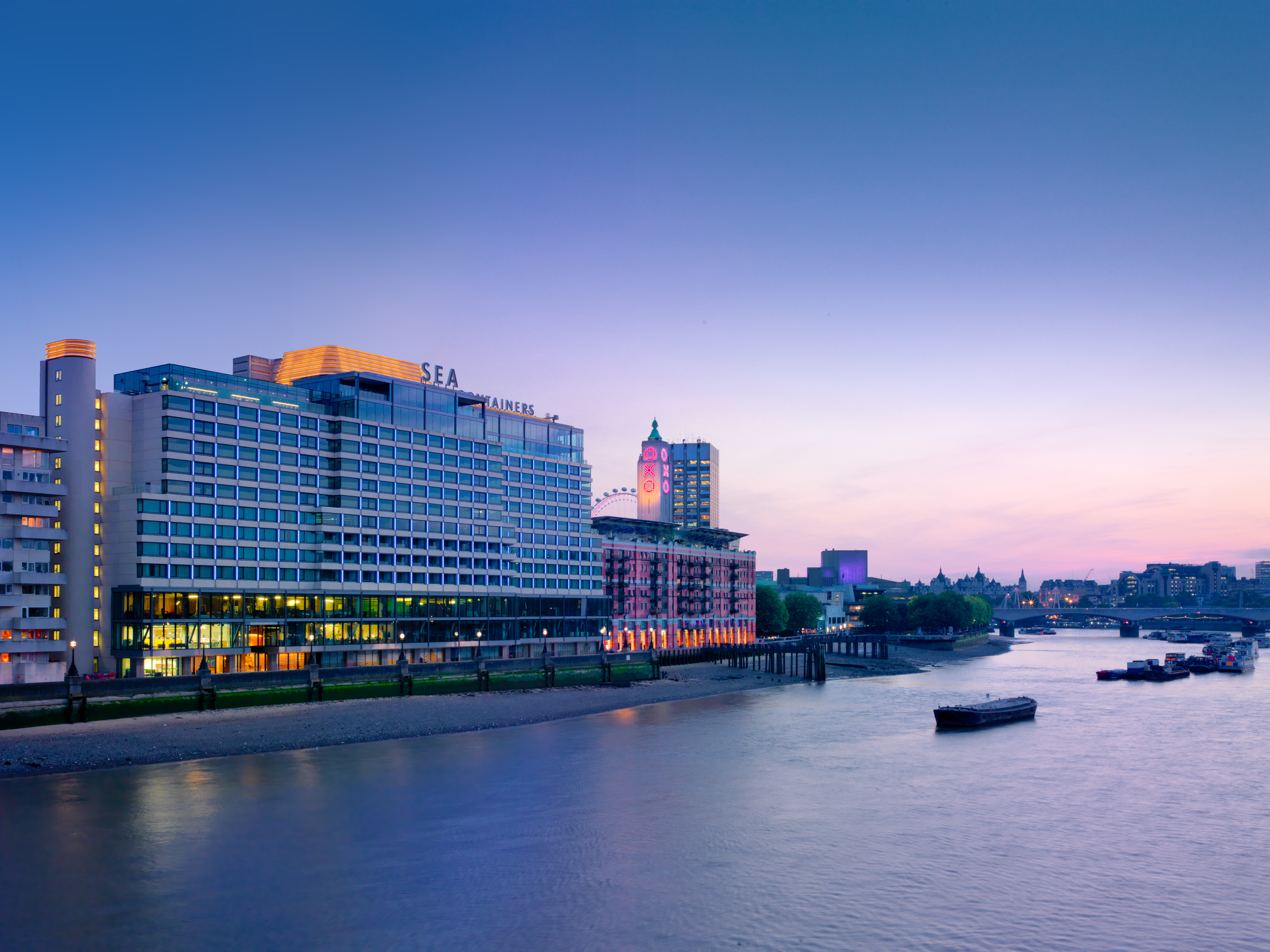 Exterior view of the modern Sea Containers London hotel building with unique architectural design.